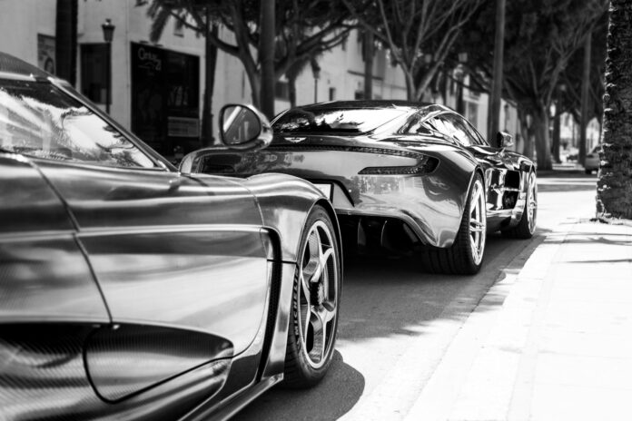 A couple of cars parked next to each other on a street